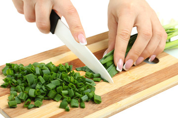 cut green onion on the board isolated