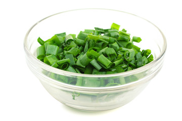 chopped green onions in a bowl isolated