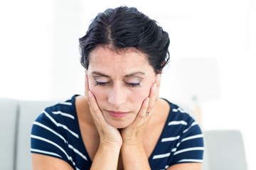 Unhappy woman sitting on the couch
