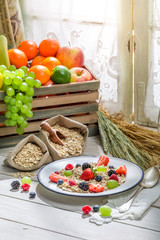 Healthy oat flakes with berry fruits for breakfast