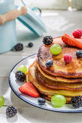Sweet pancakes with berry fruits for breakfast