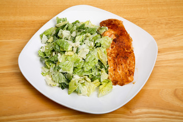 Baked Salmon with Ceasar Salad on Square Plate