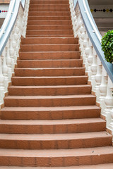 Masonry Steps Between White Railings