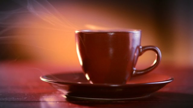 Coffee or Tea. Brown Cup of Hot Beverage with Steam