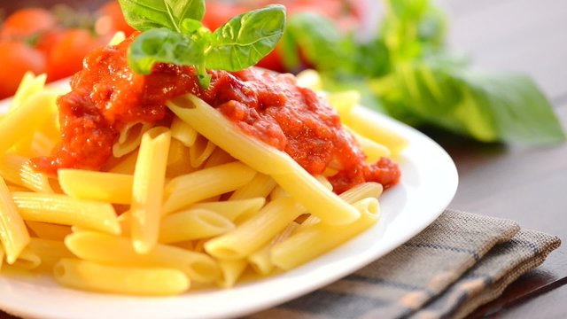 Pasta Penne with Bolognese Sauce, Parmesan and Basil
