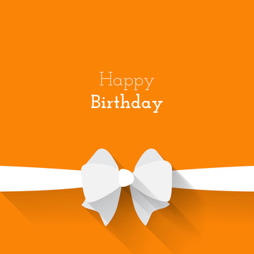 Simple card for birthday with a white paper bow on orange backgr