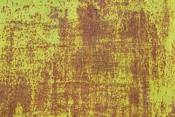 red rusted on the green yellow metal wall. Texture