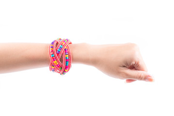 Colourful bracelets on female hand