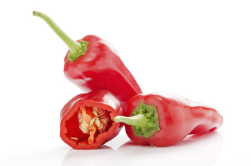 fresh red chilies on white background display