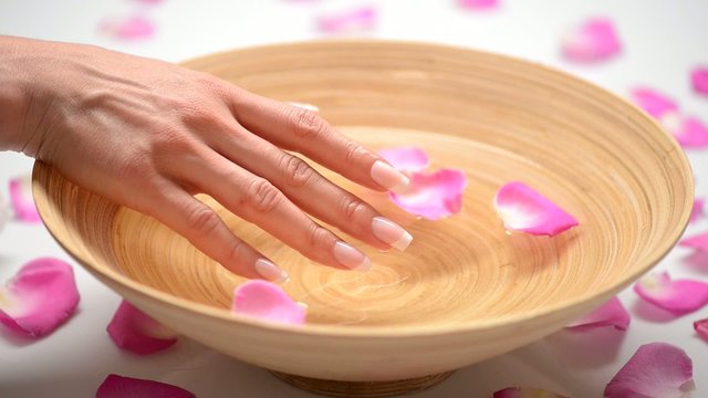 Spa hands care. Woman's nails with french manicure
