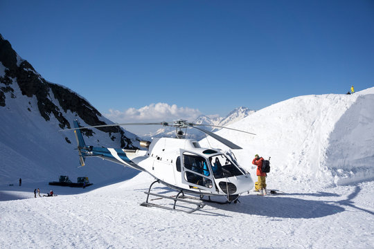 White rescue helicopter parked in the mountains