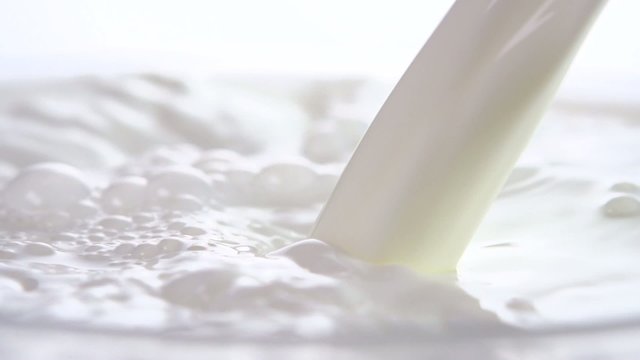 Pouring milk closeup