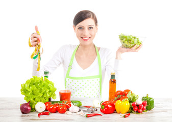 Happy woman with salad and measuring tape, healthy food and diet concept.