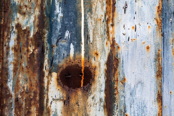 red rusted on the metal wall with planks. background and Texture