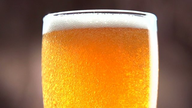 Beer in the glass. Slow motion 240 fps. Full HD 1080p