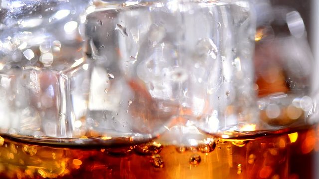 Cola pouring. Cola with ice and bubbles. Full HD 1080p