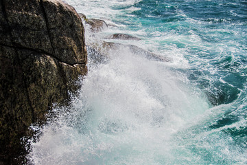wave break against the rock