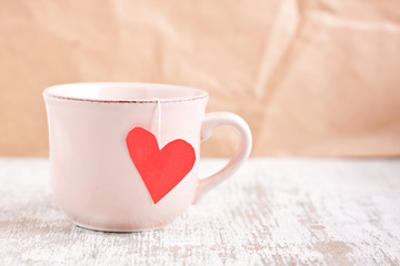 cup with heart shape tea bag