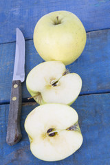 apples and knife on wood