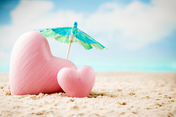 Heart on the sand on the seashore.