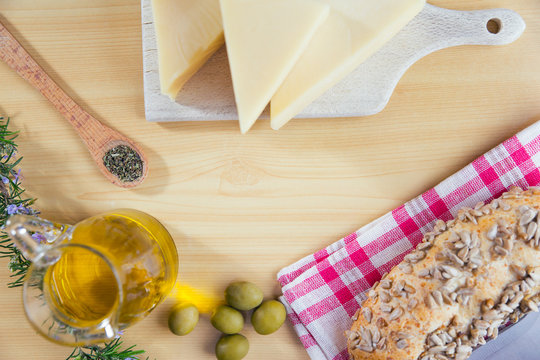 Arrangement of olive oil and cheese