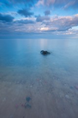 Beautiful long exposure landscape of rocky sea shore