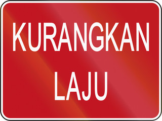 Road sign in Brunei: Kurangkan laju/Reduce speed