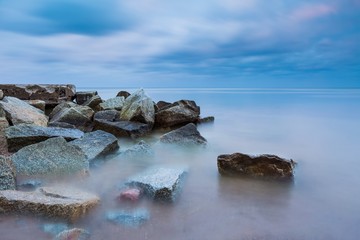Fototapeta na wymiar Beautiful Baltic sea landscape with stone breakwater.