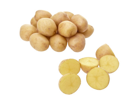 Little yellow patatoes sliced on white background