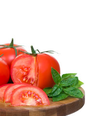 Tomatoes vertical presentation sliced on wooden plank