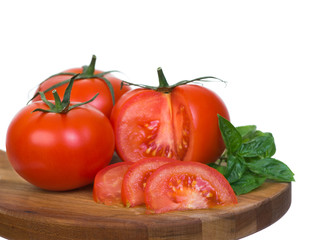 Tomatoes horizontal presentation sliced on wooden plank
