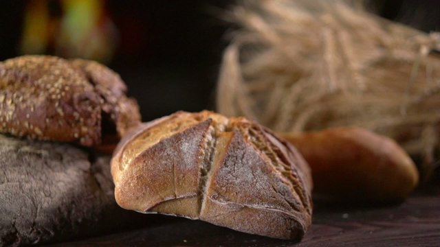 Bakery Bread on a Wooden Table. Slow Motion 240 fps