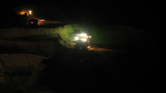 Timelapse. Excavator loading huge dump trucks