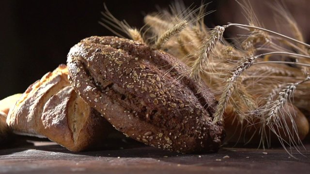 Bakery Bread on a Wooden Table. Dolly shot. Full HD 1080p
