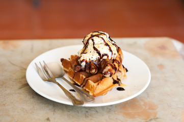 waffles with stawberry and caramel sauce