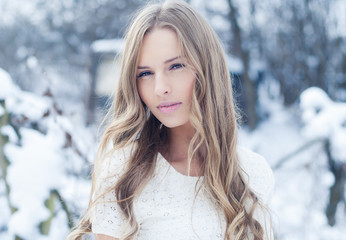 beautiful young woman in winter outdoors