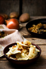 Potatoes vareniki in a ceramic bowl.