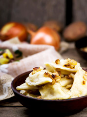 Potatoes vareniki in a ceramic bowl.