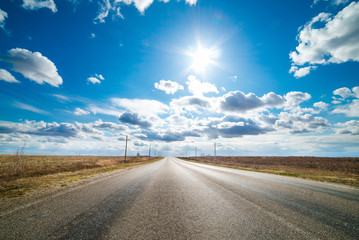 Straight road disappearing into the distance.