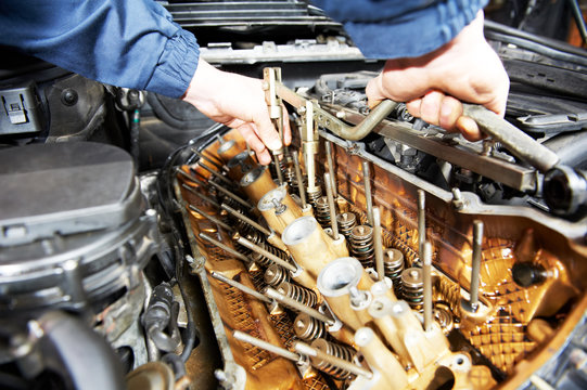 machanic repairman at automobile car engine repair