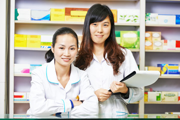 Fototapeta na wymiar Chinese pharmacy worker in china drugstore