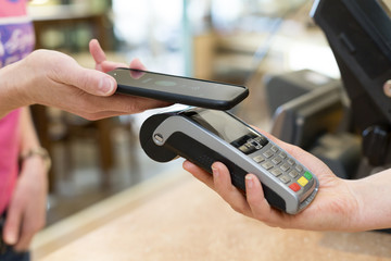 customer paying with NFC Technology