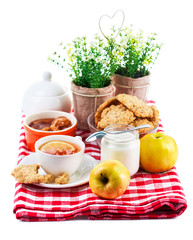 Breakfast with tea and fresh cookies. Isolated on white