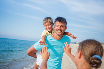 Father and kids at the beach