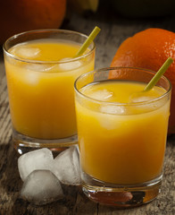 multifruit citrus juice from oranges, lemons, bananas in a glass