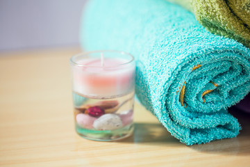 Fototapeta na wymiar Composition with spa treatment, towels and candle