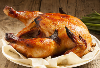 baked chicken on a plate with pita bread