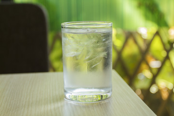 glass of water on wood table