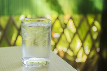 glass of water on wood table