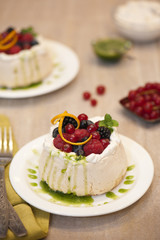 Pavlova with forest fruits and basil coulis